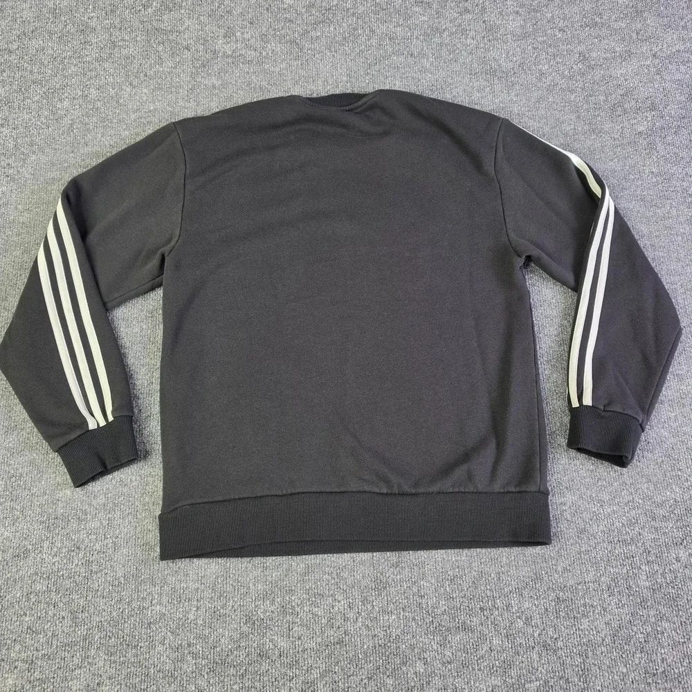 Adidas black crewneck sweatshirt with white stripes on sleeves, size M